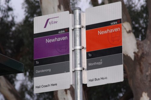 Bus signage at Newhaven, Phillip Island - purple for the V/Line coach to Dandenong, and orange for the local bus to Wonthaggi 