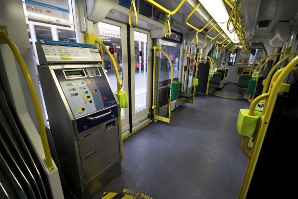 Intermediate section of a D2 class Combino tram: the one with four doors and the Metcard ticket machine