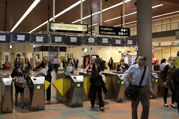 Metcard barriers at Flagstaff Station, with the new LCD next train displays behind