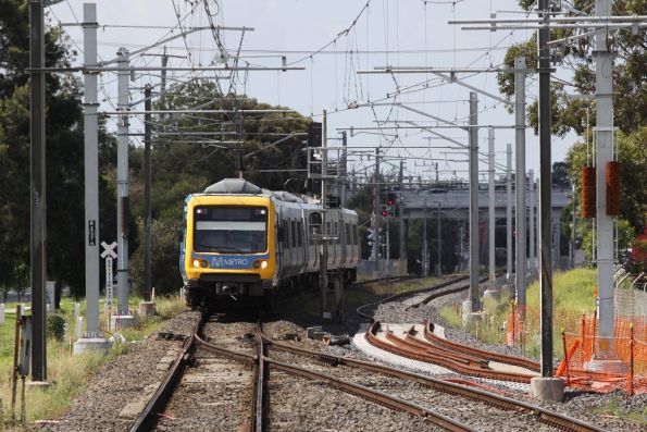 Heading along the single track, an up X'Trapolis arrives at Keon Park