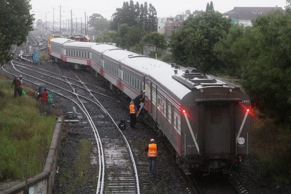 Detraining passengers through the conductor's van with a single ladder