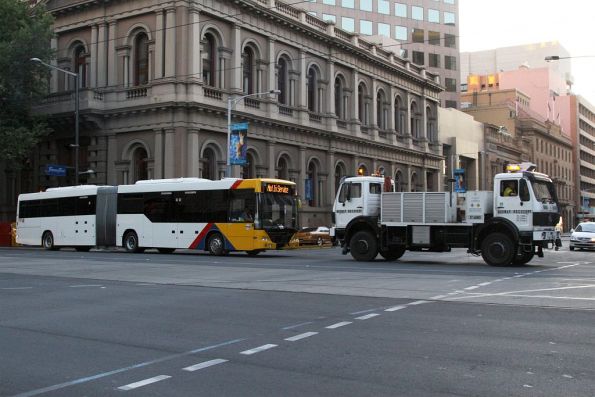 Disabled artic #1147 under tow at Currie and King William Streets