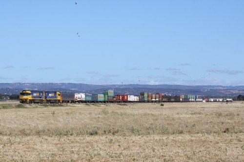 Double stacked PN freight heads west out of Adelaide near Bolivar