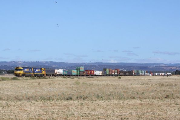 Double stacked PN freight heads west out of Adelaide near Bolivar