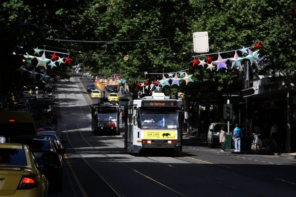 A2.266 on route 11 leads a classmate westbound on Collins Street