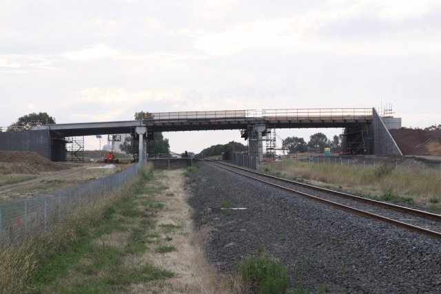 Three span bridge in place over the railway line, looking west