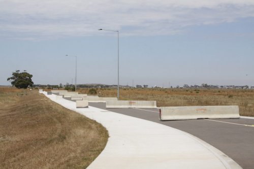 The completed access road, with concrete traffic barriers preventing local hoons from using it