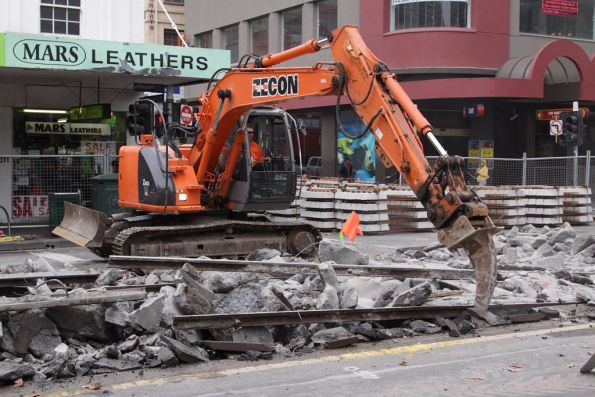 Separating out the lengths of old rail from the chunks of concrete