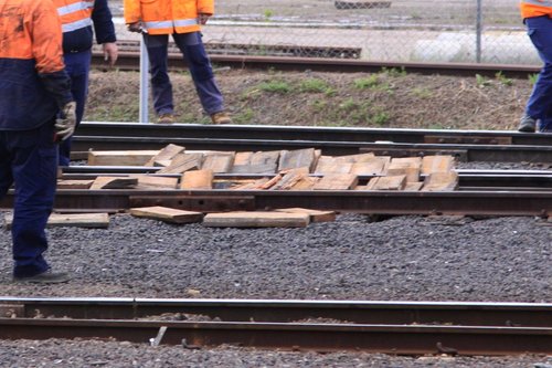 Pile of wooden packing pieces used to get the derailed 8114 back onto the rails