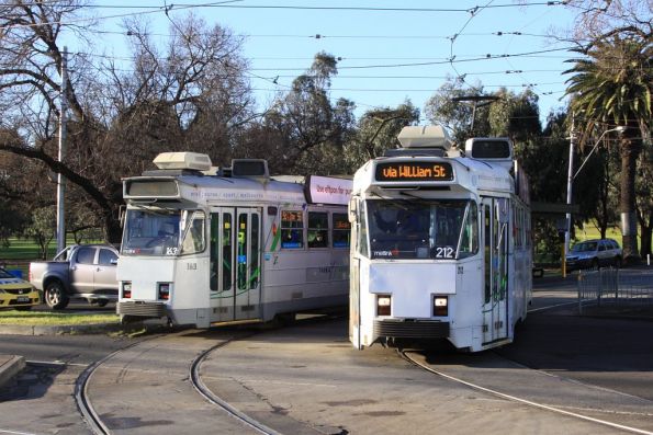 Z3.212 passes Z.163 at the corner of Flemington Road and Royal Park