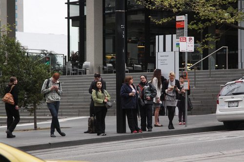 Decent sized crowd waiting outside Southern Cross Station for the route 235/237/238 buses to Fishermans Bend