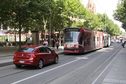 Dingbat tries to follow a tram through the City Sqaure tram stop on Swanston Street