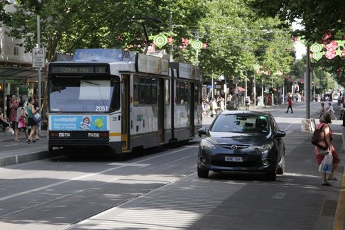 This takes the cake: driving along the footpath of the Bourke Street tram stop on Swanston Street