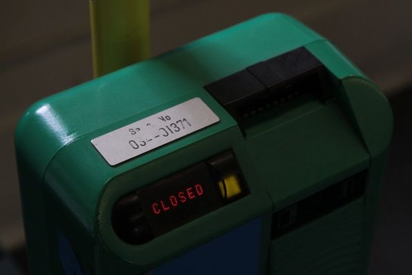 Metcard validator onboard a tram, displaying a 'CLOSED' message and a green light