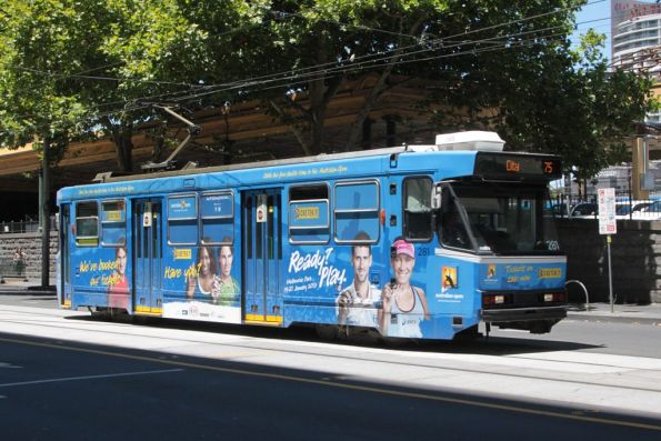 A2.281 advertising the 2013 Australian Open heads west on Flinders Street