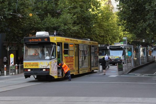 Mechanic pushes A2.288 clear of the tram stop at Collins and Elizabeth Street