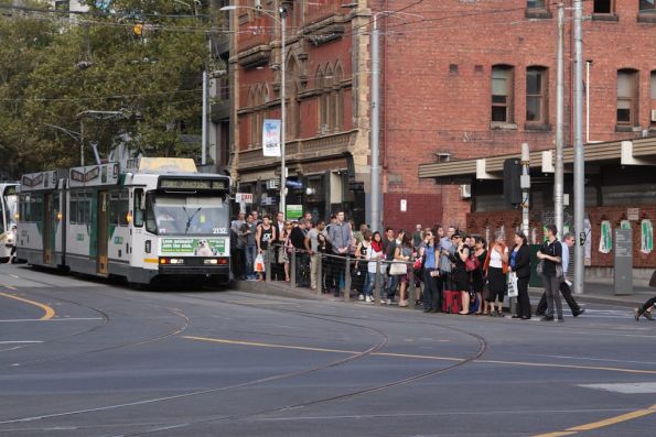 Hoards of passengers attempt to leave the tram stop at Bourke and Spencer Streets