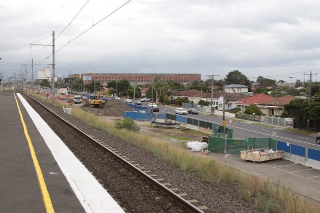 Looking up the line, work on the additional track pair continues