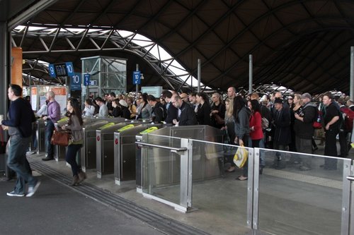 Slow Myki gates cause a queue to exit Southern Cross at the Bourke Street end