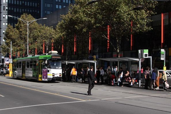 Passengers waiting for northbound trams on Elizabeth Street at Bourke