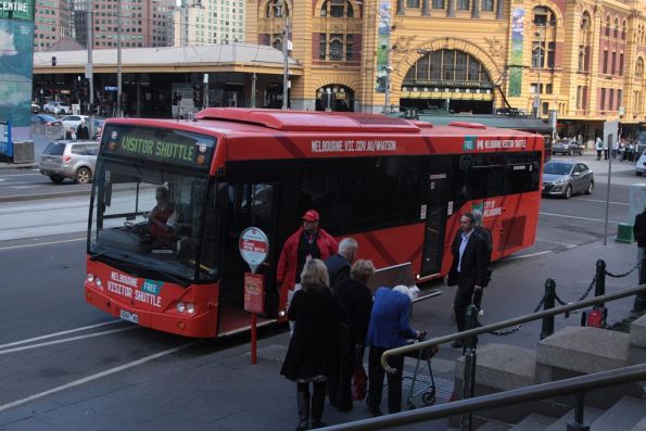 Melbourne Free Visitor Shuttle waiting for passengers outside Federation Square, with bus #42 rego 1042AO