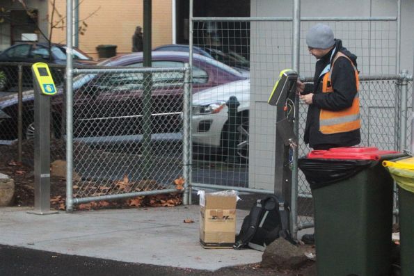 After years of waiting, Bytecraft technician installs the additional Myki readers at Kensington platform 2