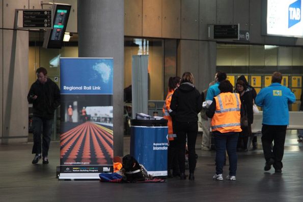 Regional Rail Link staff informing Ballarat and Bendigo commuters of the upcoming 2 week long shutdown