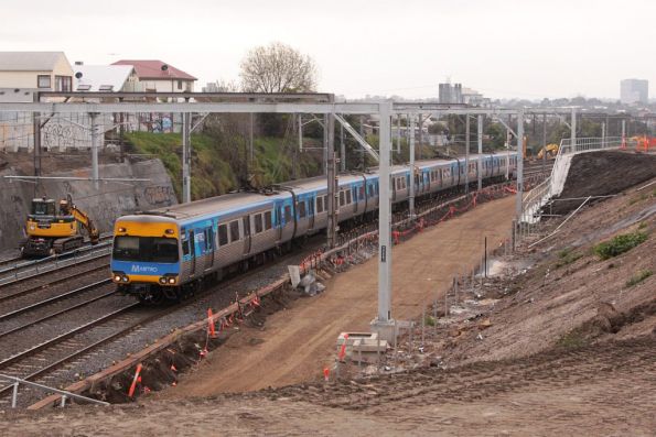 Comeng on a down Werribee train passes through the widened cutting outside Footscray