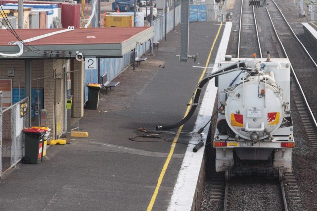 Hi-rail suction excavation truck sitting on the down track