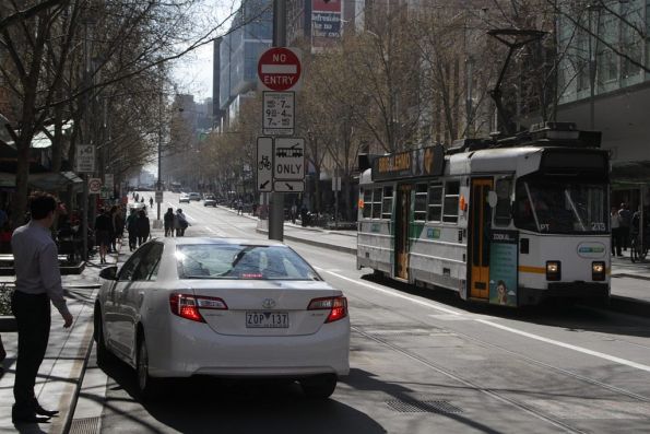 Dingbat drives north up the Swanston Street bike lane at Swanston Street