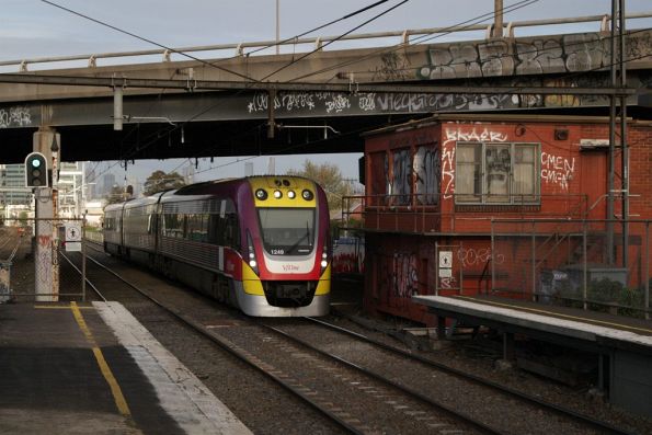 VLocity 3VL49 passes the abandoned signal box beneath 'Mount Mistake' at West Footscray