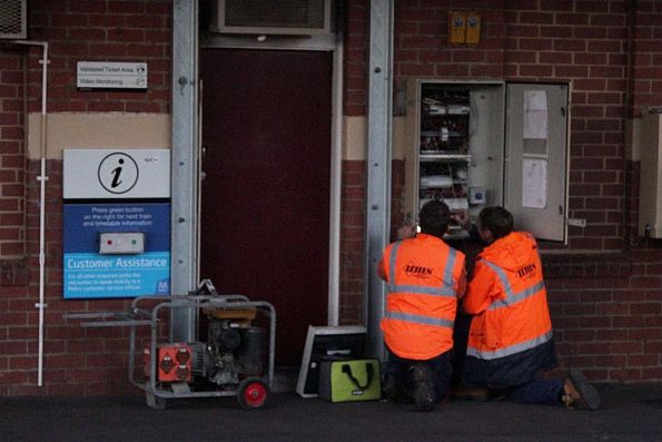 Contractors work to connect a generator to the switchboard on up platform