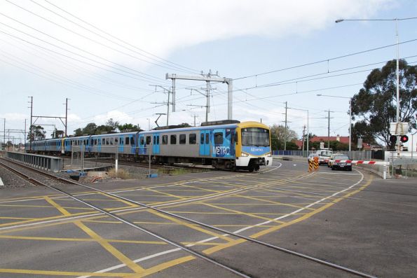 Siemens train on a down Sunbury service crosses the temporary Anderson Road level crossing at Sunshine