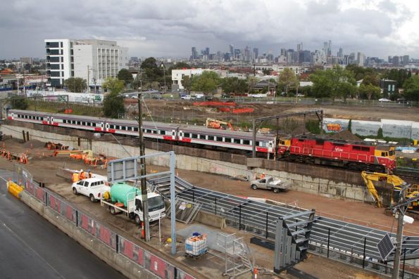 N469 leads a down Geelong service through Footscray