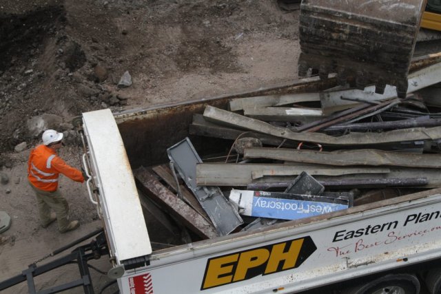 'West Footscray' station sign in the rubble