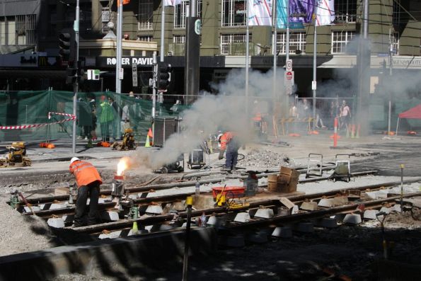 Welding rails at the corner of Elizabeth and Bourke