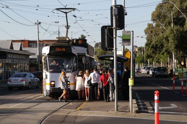 Passengers crowd aboard a citybound route 57 tram at Epsom and Union Roads