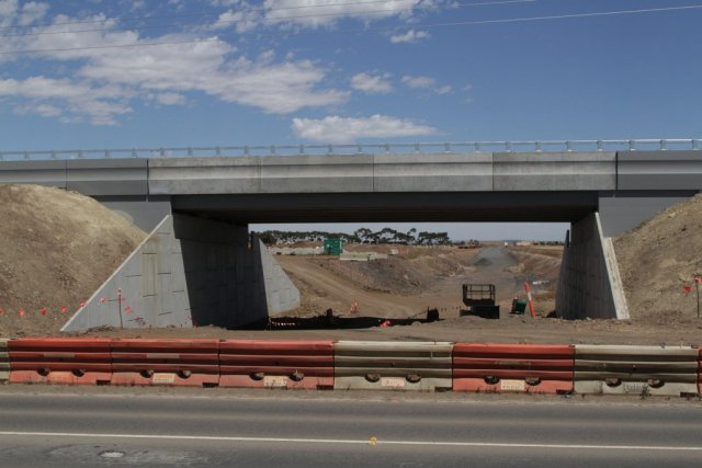 Almost completed road over rail bridge at Derrimut Road