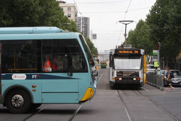 Ventura liveried Transdev bus #612 rego 7235AO opposite tram A2.282 at King and La Trobe Streets