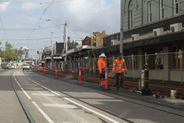 Work crews weld the rail into long length in preparation for the Mount Alexander Road works