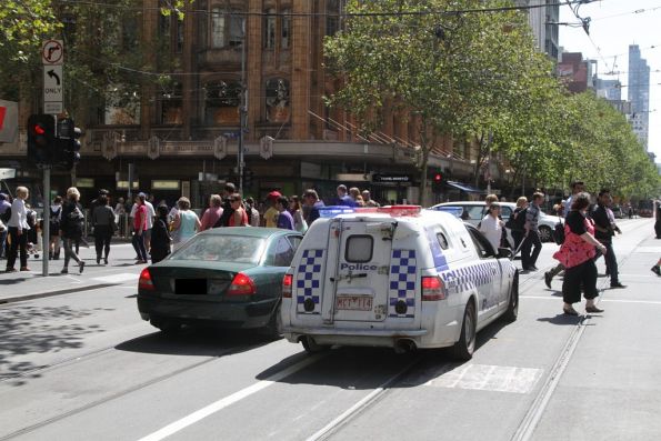 Sign of the apocalypse - Victoria Police pull over a car that drove through a Swanston Street tram stop