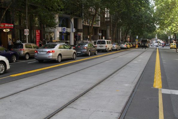 Yellow plastic kerbing in place along the Collins Street tram tracks