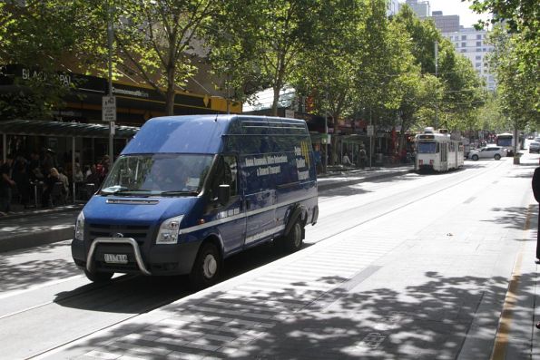 Van driver heads south through the Swanston and Bourke Street tram stop