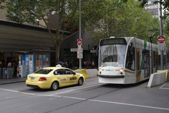 Tram driver goes DING DING DING as the taxi driver guns it down the Swanston Street tram tracks