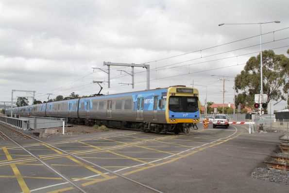 Citybound Comeng crosses the Anderson Road level crossing in Sunshine 