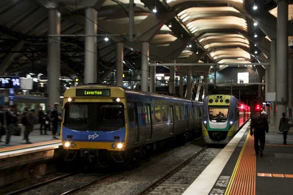 EDI Comeng arrives into platform 14 at Southern Cross, with a V/Line service in platform 15