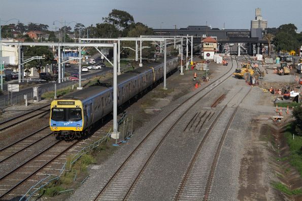 EDI Comeng on a down Watergardens service passes works on the new RRL tracks on the down side of Sunshine station