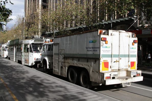 Recovery truck R10 follows defective tram Z1.86 southbound at Swanston Street and Flinders Lane