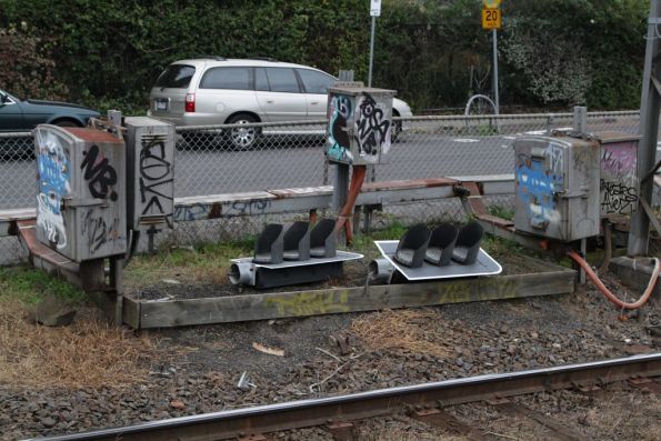 Now-redundant LED signal heads waiting collection beside the Craigieburn line