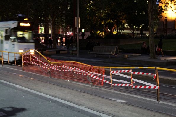 Damaged median fence at the State Library tram stop on Swanston Street